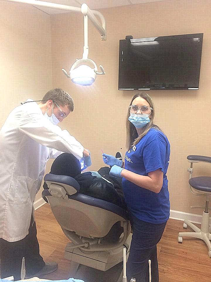 Dr. Justin Neibauer performing root canal procedure at his dental clinic in Fredericksburg, VA 22407
